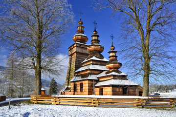  Ancient  greek catholic wooden church  in Kwiaton village at winter time, Beskid Niski, Poland