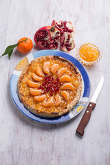 cake with tangerine marmalade and pomegranate