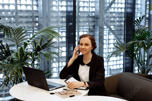 Business Portrait The Woman In A White Blouse And Black Business Portrait The Woman In A White Blouse And Black Jacket Talks On