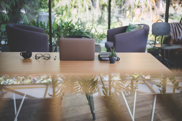 ballpoint pen, computer, eyeglasses, notebook on office desk. business, workplace, education concept.