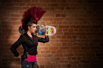 Punk girl on brick wall background