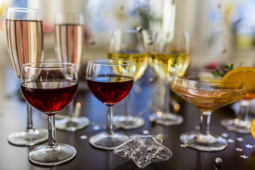 New Year's party. White and red wins and drinks in glasses. 
