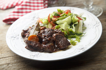 Beef stew with vegetables and red wine