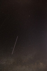 Meteoric Track In Night Starry Sky Background. Natural Glowing Stars