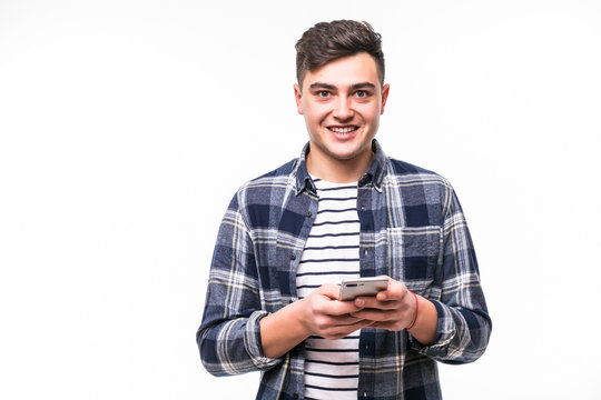 Handsome young man using his smartphone on white background