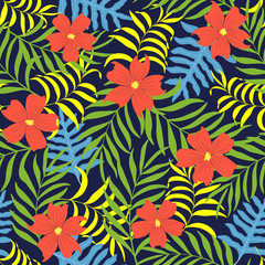 Tropical background with palm leaves and flowers. Seamless jungle floral pattern