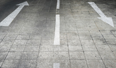 Arrow on the road and white color