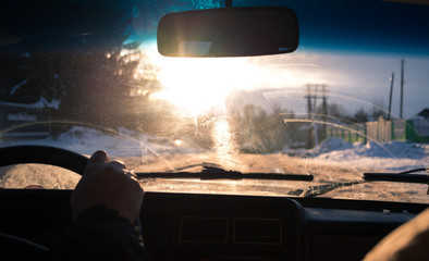 View from car window in winter snowy evening. Concept travel.