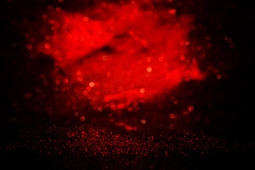 black and red glitter lights background. defocused.