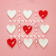 Valentine's day concept with hearts X-O game. Tic tac toe game concept.Top view.