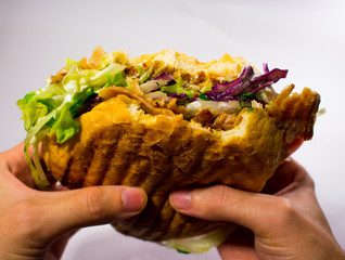 döner kebab being held up