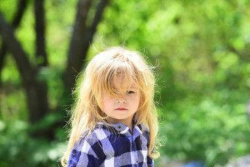 Fototapeta premium Child in park with green trees