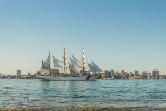 Tall ship in the harbour with Halifax downtown skyline on a sunny day