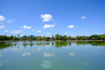 Sukhothai Historical Park with huge lake, reflection, mountain and blue sky