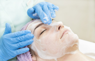 Process cosmetic mask of massage and facials in beauty salon