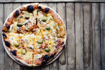 The fresh, rural, tasty pizza made with addition of olives and mushrooms