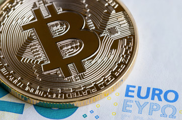 Fototapeta na wymiar Bitcoin / Cryptocurrency is Digital payment money Concept, Gold coins with B letter symbol,electronic circuit on EURO EYP20 bill.Cryptocurrency can uses designed work as medium of exchange in network
