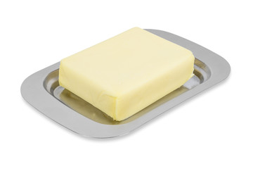 Piece of butter in metal box on white background