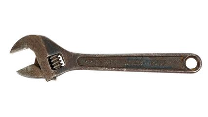 Rusty adjustable wrench on white background