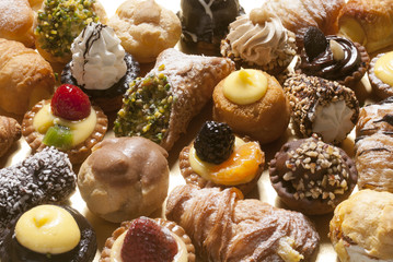 mix of little pastries with chocolate, strawberry, almonds and various kind of creams

