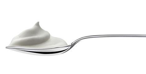 steel spoon filled of milk cream, isolated on white
