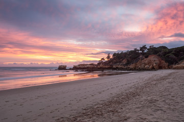 Red magic sunset on the beach of Oura in Albufeira. Portugal