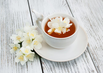 Cup of tea with jasmine flowers