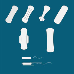 Different types of tampons on blue background
