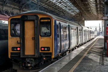 Naklejka na ściany i meble The train at platform 2 is for Manchester Victoria