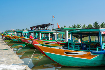 Tourist boats in harbor in the city of Hoi An, Vietbam