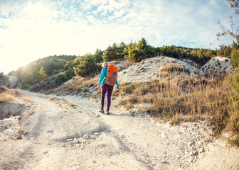 Fototapeta premium A girl with a backpack.