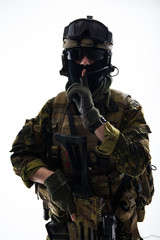 Hush. Portrait of calm peacemaker keeping finger near mouth. Ammunition concept. Isolated