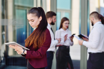 cute young business woman on the background of office colleagues ai