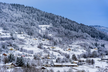 Fototapeta na wymiar French Alps village in the winter time and under a heavy snow