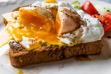 Poached Egg on Toast Bread with Cheddar Cheese, Balsamic Vinegar, Salad and Black Sesame or Cumin Seeds