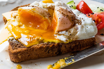 Poached Egg on Toast Bread with Cheddar Cheese, Balsamic Vinegar, Salad and Black Sesame or Cumin Seeds