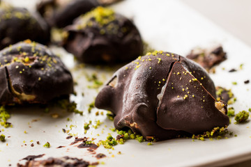 Chocolate Covered Chestnut Dessert with Pistachio Powder. / Kestane Sekeri