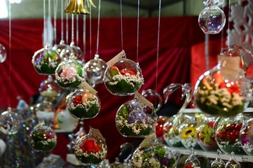Christmas Decoration and Spheres hanging from the roof in a Christmas Market.