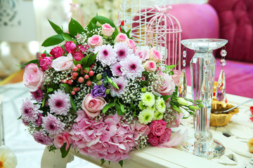Multi-colored flower bouquet . Multi-colored engagement flower bouquet . Beautiful bouquet of colored roses wrap with white paper