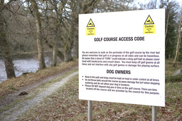 golf course access code rules for public walkers and dog owners sign caution and warning danger of stray balls