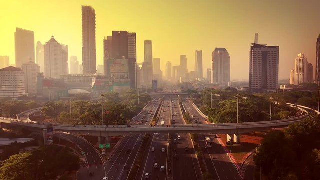 JAKARTA - Indonesia. December 26, 2017: Aerial view of Semanggi road interchange and office building from a drone at dusk time, shot in 4k resolution