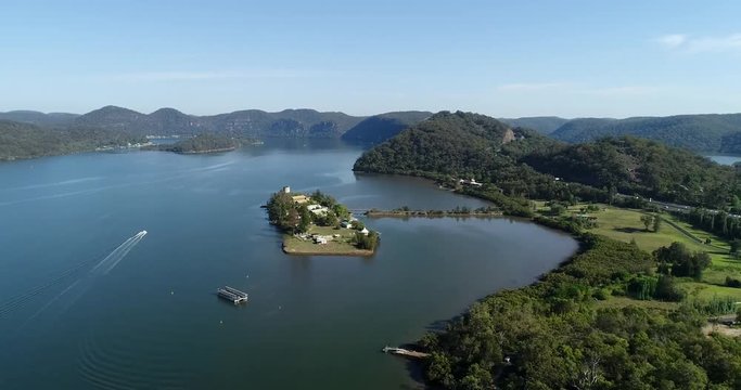 Spectacular panorama of Hawkesbury river on Australian Central coast with hill ranges on the horizon and still flowing water around Mooney Mooney on M1 motorway.
