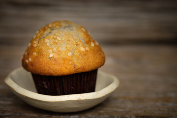 Still life blueberry muffins in a rustic style.
