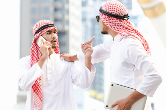 Arab two business man couple quarrels in the city - Powered by Adobe