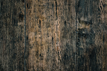 Old dark weathered distressed damaged stained grunge oak wood grain wall rustic background texture photo