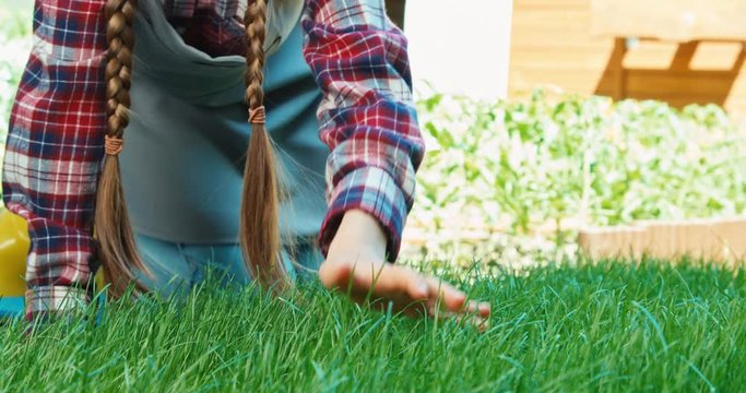 Child touching grass