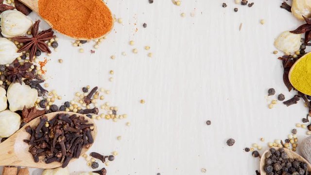 Top view timelapse footage of spices and herbs on table in the studio, shot in 4k resolution