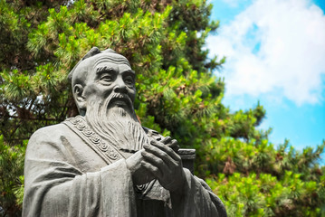 Statue of Confucius, located in Harbin, Heilongjiang, China. - obrazy, fototapety, plakaty