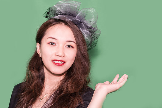 The portrait of a young oriental girl with fascinator