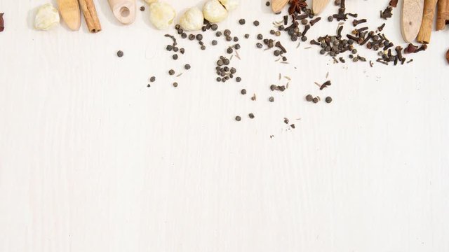Timelapse footage of spices and herbs with wooden spoon for cooking on the table, shot in 4k resolution
